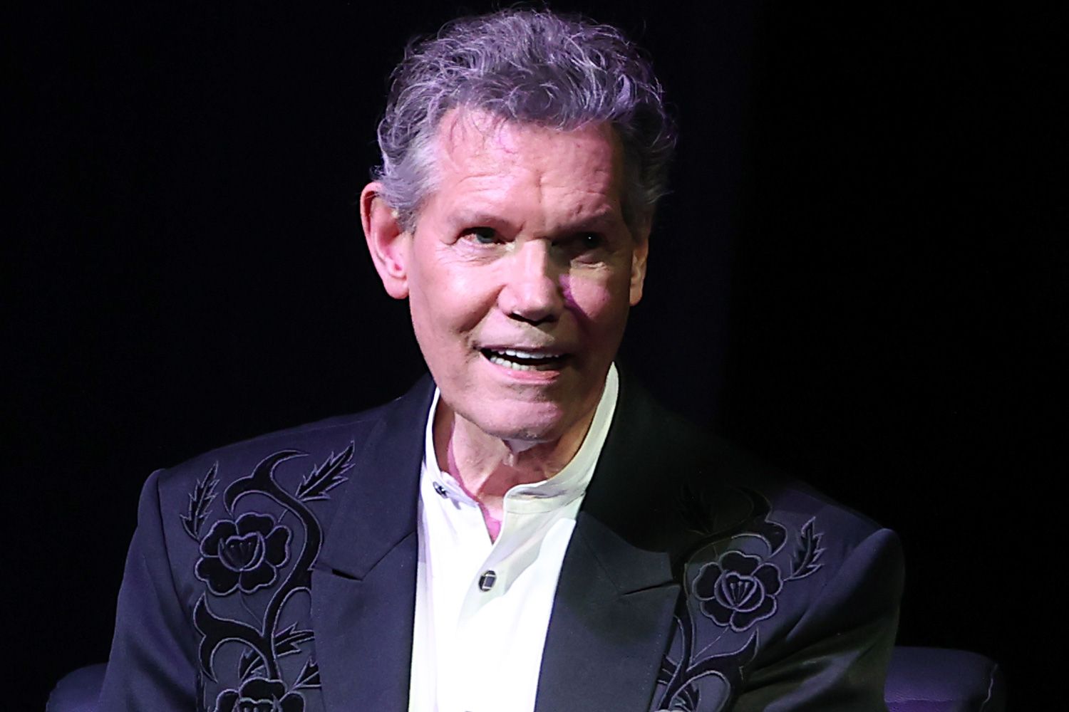 Country Star Randy Travis Gets Standing Ovation as He's Wheeled onto Tour  Stage After Stroke