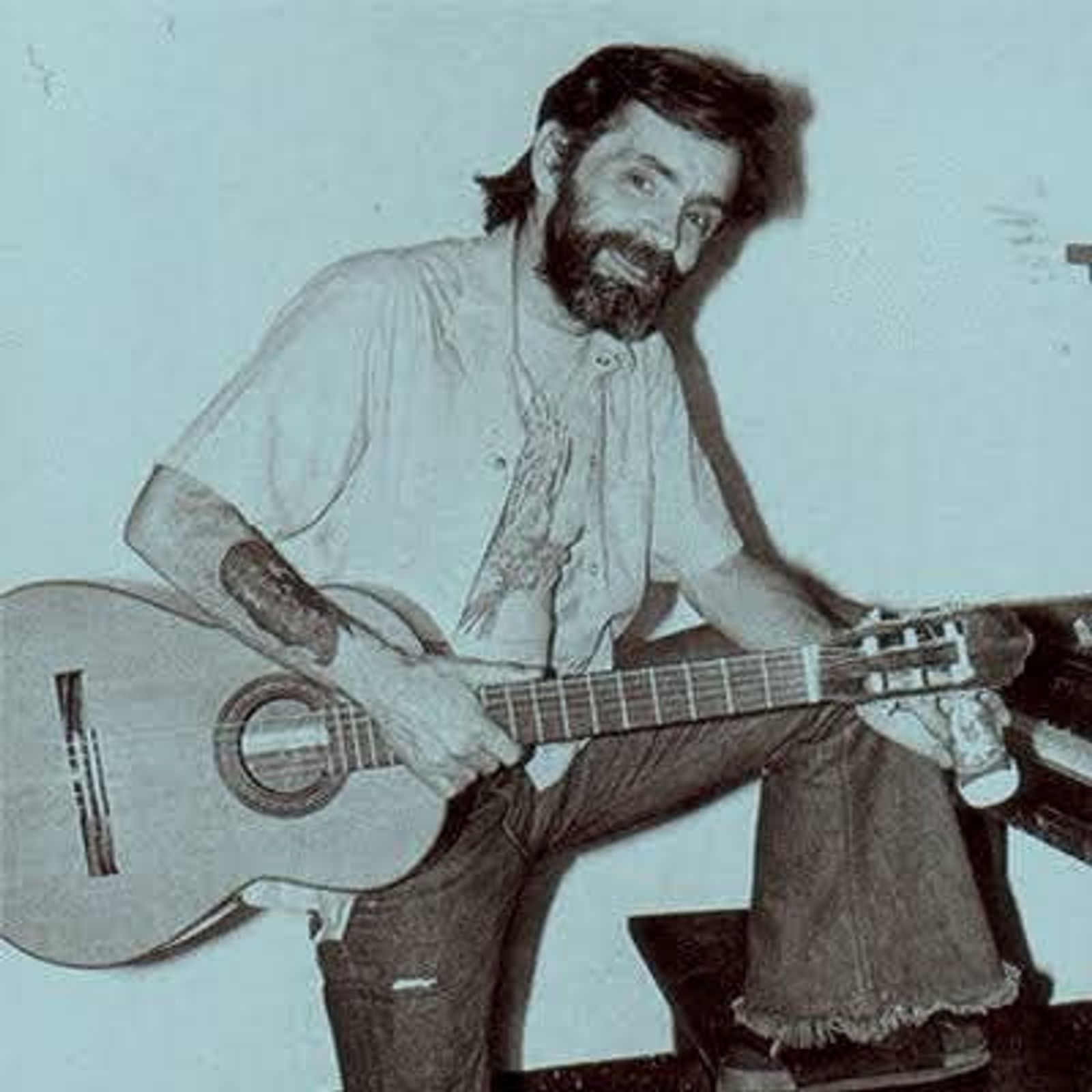 Charles Manson holding a guitar, Photo Credit: Paracetamol/X
