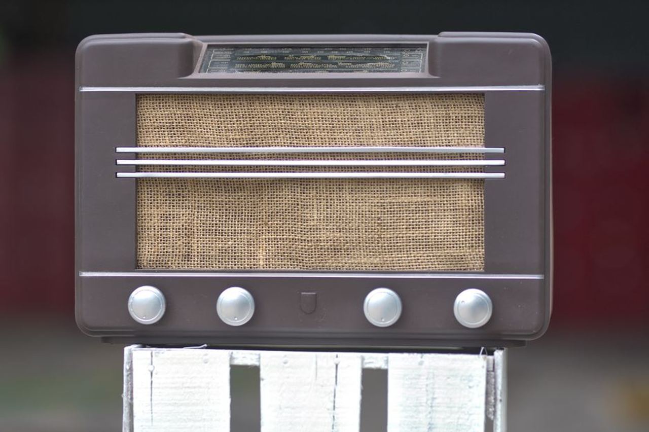 Close-up of a vintage brown radio with a retro design and classic styling.